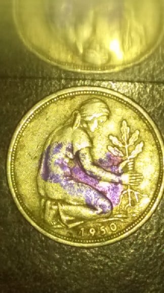 Foto 1 Moneda sin identificar: el materia que esta creada