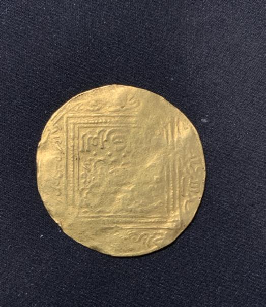 Foto 1 Moneda sin identificar: Moneda árabe algo desgastada
