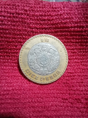 Foto 1 Moneda sin identificar: Es error o desgaste por el tiempo